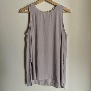 Lush lavender sleeveless chiffon blouse with side slits and keyhole back detail